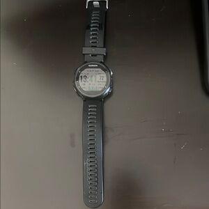 Garmin Black Smartwatch with Circular Display and Silicone Strap